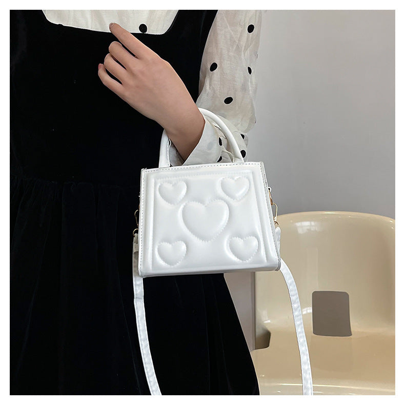 1pc Women’s Stylish Solid Color Handbag with Detachable Strap – Heart Pattern Design, Perfect for Valentine’s Day Gift, Available in Magenta, White, Black, Green, Yellow